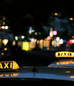 shallow focus photography of Taxi signage